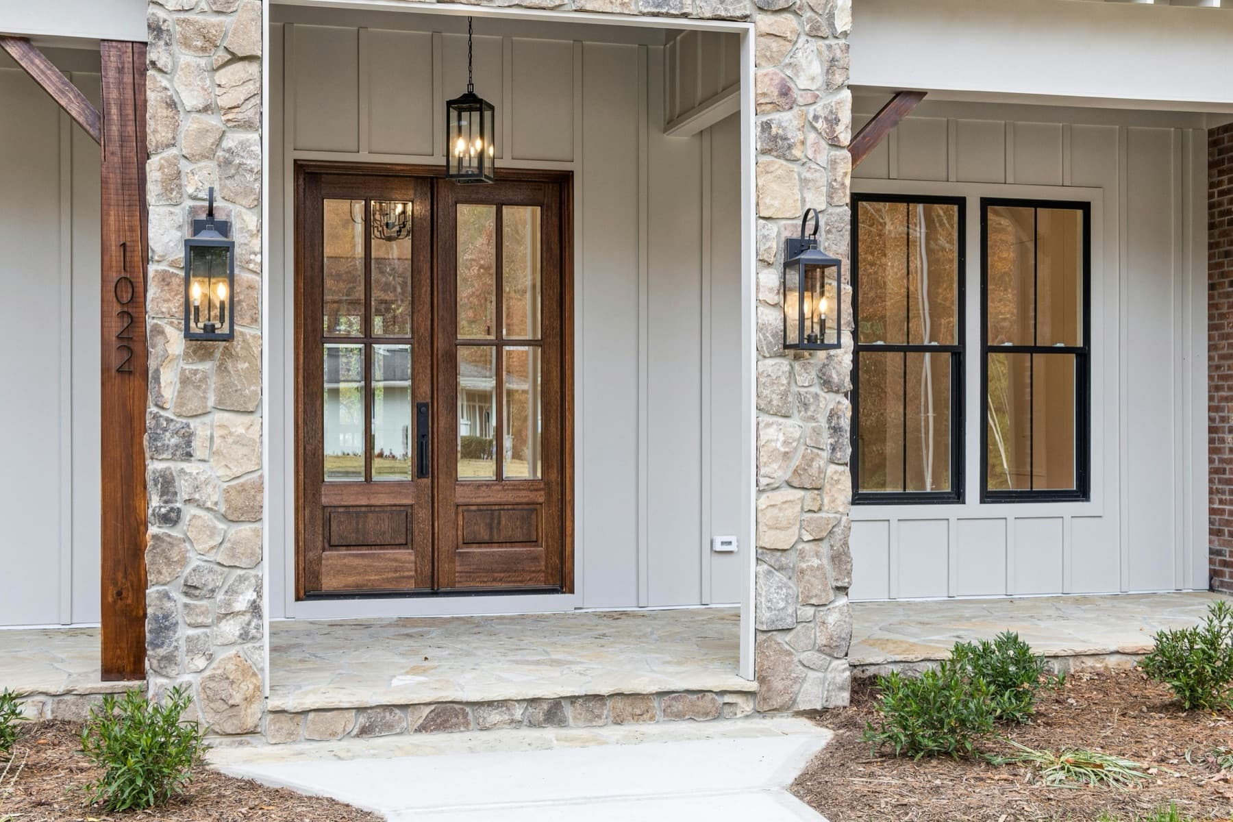 Front door and porch detail on a residential home.